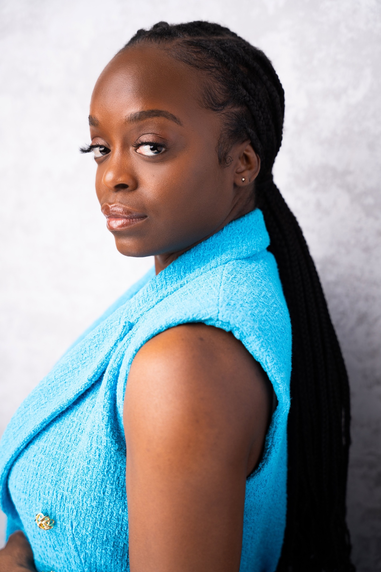 Studio headshot — blue